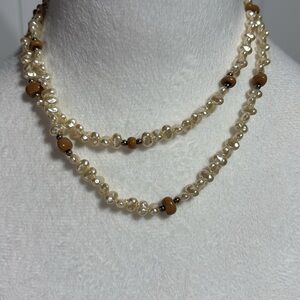 Faux multi-cream colored pearl necklace with tan beads